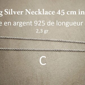 May include: A sterling silver necklace, 45 cm in length, displayed on a neutral background. The chain is made of small, interconnected links. The image also includes text indicating the necklace's material and weight.