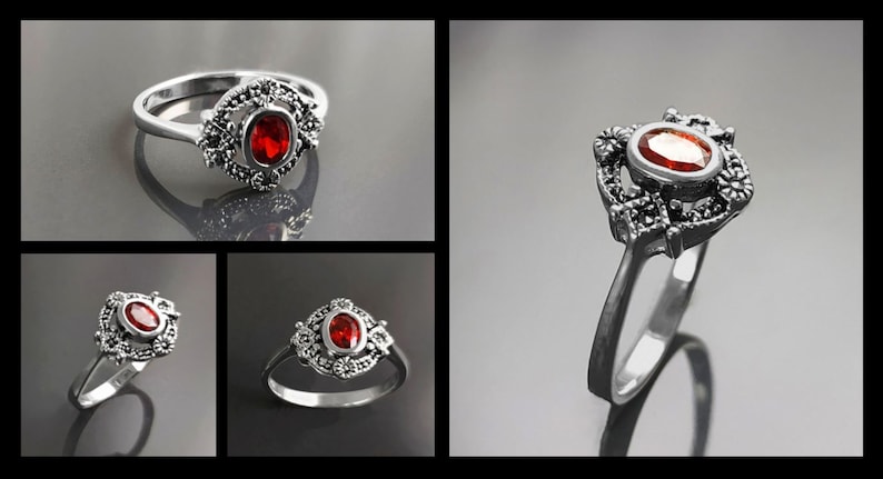 K&ouml;nnte beinhalten: Silberner Ring mit einem ovalen, roten Edelstein im Zentrum. Der Edelstein ist von einer dekorativen, bl&uuml;tenartigen Fassung umgeben. Der Ring wird in verschiedenen Ansichten pr&auml;sentiert, um sein Design hervorzuheben.