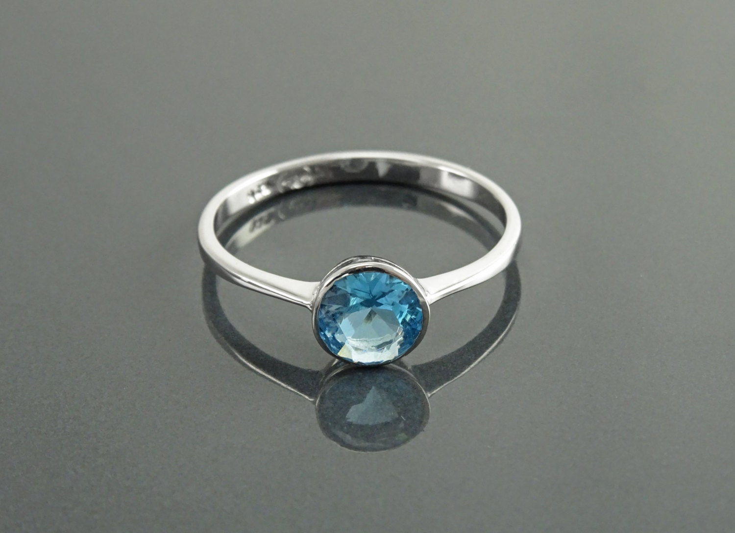 Zephyr Ring with a 6.62 Carat Light Blue Sapphire, Accent Sapphire and –  Midwinter Co. Alternative Bridal Rings and Modern Fine Jewelry