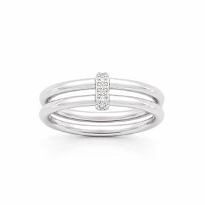 May include: A polished silver-tone ring featuring two parallel bands connected by a central vertical bar. The small rectangular connector is encrusted with multiple tiny clear stones that catch the light, creating a bright, reflective surface.