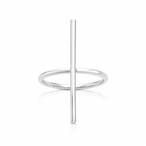 May include: A silver-toned ring featuring a thin, circular band intersected by a vertical, straight metal bar that extends above and below the band. The piece has a polished, reflective surface and a clean, geometric structure throughout.