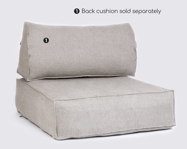 May include: A light gray linen floor cushion with a matching back cushion. The back cushion is sold separately. The floor cushion is rectangular and has a simple design.