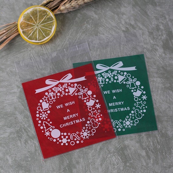 100 Sacchetti Natalizi Trasparenti Con Fiocchi Di Neve: Confezioni Regalo In OPP Per Caramelle, Biscotti E Cioccolatini. Dimensioni 27x12,3 Cm, Con Chiusura A Strappo. Ideali Per Bomboniere E Feste Di Natale.