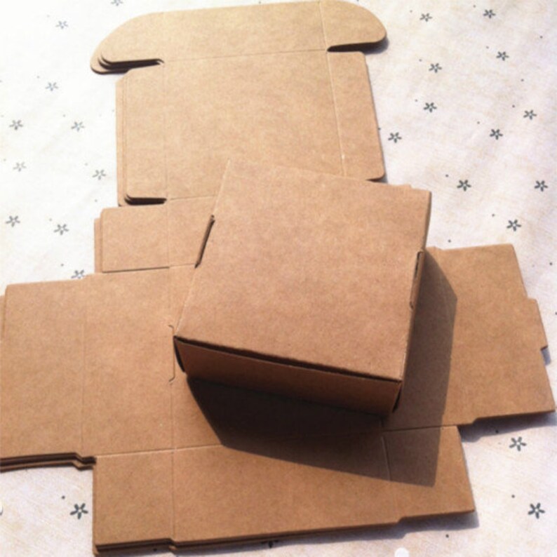 May include: A set of brown cardboard boxes, folded flat, ready to be assembled. The boxes are made of sturdy cardboard and have a natural, rustic look.