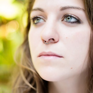 Minimalist Indian inspired faux septum cuff ring with a lotus design in sterling silver.