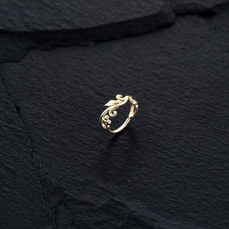 A beautiful leaf helix cartilage hoop in 14k gold plated over a sterling silver base.