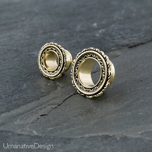 Gold feather gauges. unique ear gauges. plugs and tunnels. 6g 4g 2g 0g 00g 000g ear tunnels