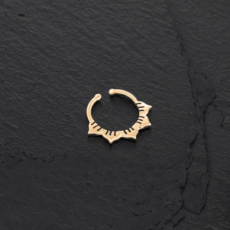 Minimalist Indian inspired faux septum cuff ring with a lotus design in 14k gold plated on a sterling silver base.