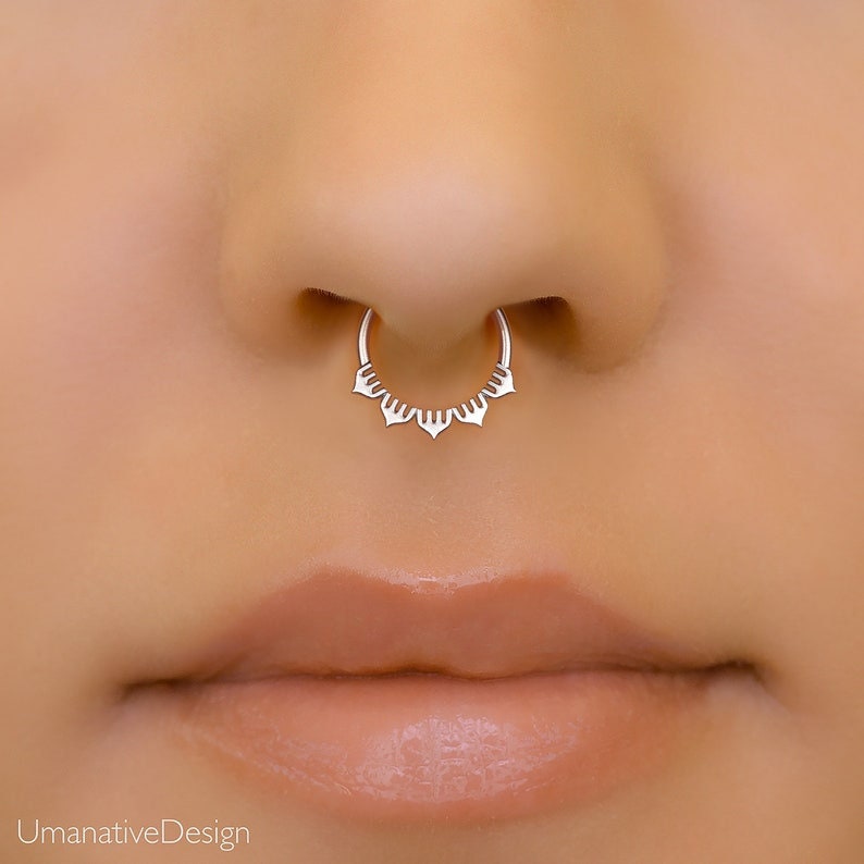 Minimalist sterling silver septum ring with a unique lotus shape design. 8mm in diameter
