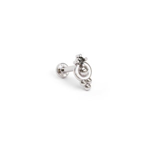May include: Silver body jewelry with a black gemstone and a circle design with dangling beads.