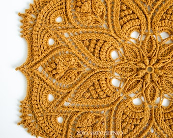 May include: A large, intricate crochet doily in a warm mustard yellow color. The doily features a repeating pattern of delicate floral motifs and intricate lacework.