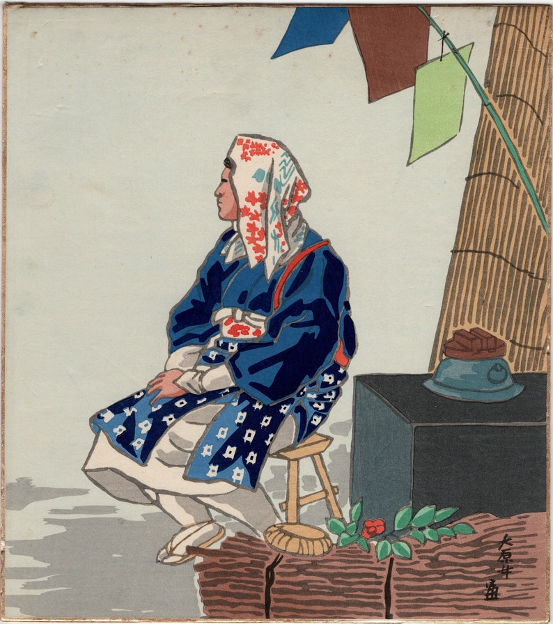 May include: A woodblock print depicting a person wearing a blue robe and a white and red patterned head covering. The person is sitting on a wooden stool with a dark blue and brown object in the background. The print is signed in Japanese characters.