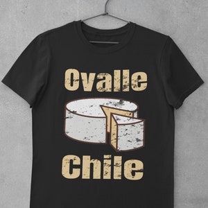 May include: Black t-shirt featuring a distressed graphic of a cheese wheel and the text "ovalle chile" in a vintage style.