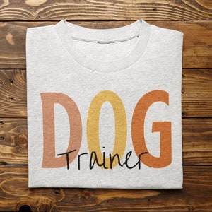 Divertente addestratore di cani camicia Vintage addestratore di cani Tee pastello amante dei cani regalo design manica corta t-shirt unisex per addestramento canino dog walker