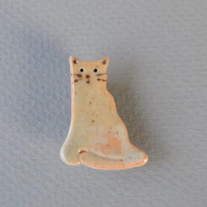 Ceramic Cat Brooch made from Porcelain Clay and Handmade Shino Glaze specially suited for Reduction Firing