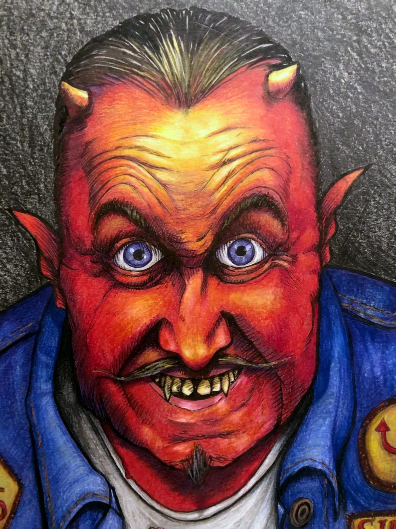May include: A red-skinned man with horns and a goatee, wearing a blue denim jacket with a yellow patch. He has a mischievous grin and sharp teeth.