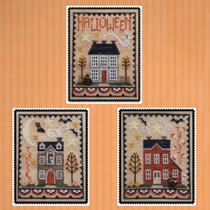 May include: Three cross-stitch patterns featuring a house with a red door and a black roof. The first pattern says "HALLOWEEN" and has a ghost. The second pattern says "TRICKS" and has a bat. The third pattern says "TREATS" and has a cat.
