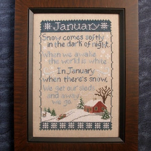May include: A framed cross-stitch sampler with a winter scene and a poem about January. The poem reads: "Snow comes softly in the dark of night. When we awake the world is white. In January when there's snow, We get our sleds and away we go."