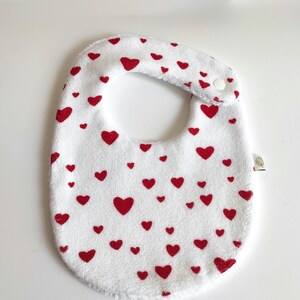Bib in double gauze fabric Oeko-tex. and bamboo sponge Oeko-tex heart pattern.