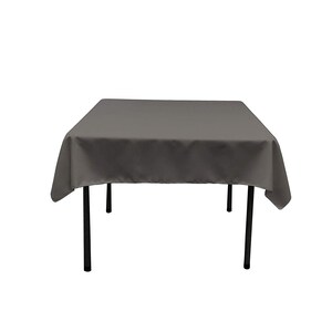May include: A gray square tablecloth draped over a table with black legs.