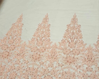 Pink flowers embroider and heavy beaded on a mesh lace fabric-sold by the yard. main image 1