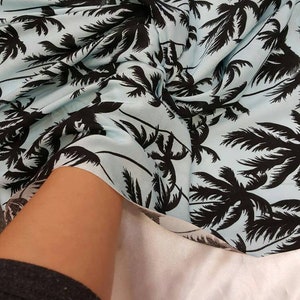 100% Rayon challis black Palm tree on baby blue background