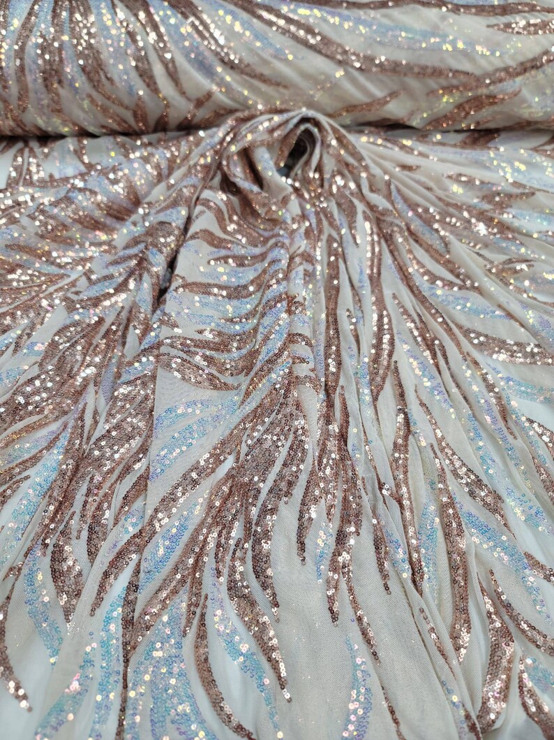 May include: White mesh fabric with a rose gold sequin pattern. The sequins are arranged in a wavy, flowing design.