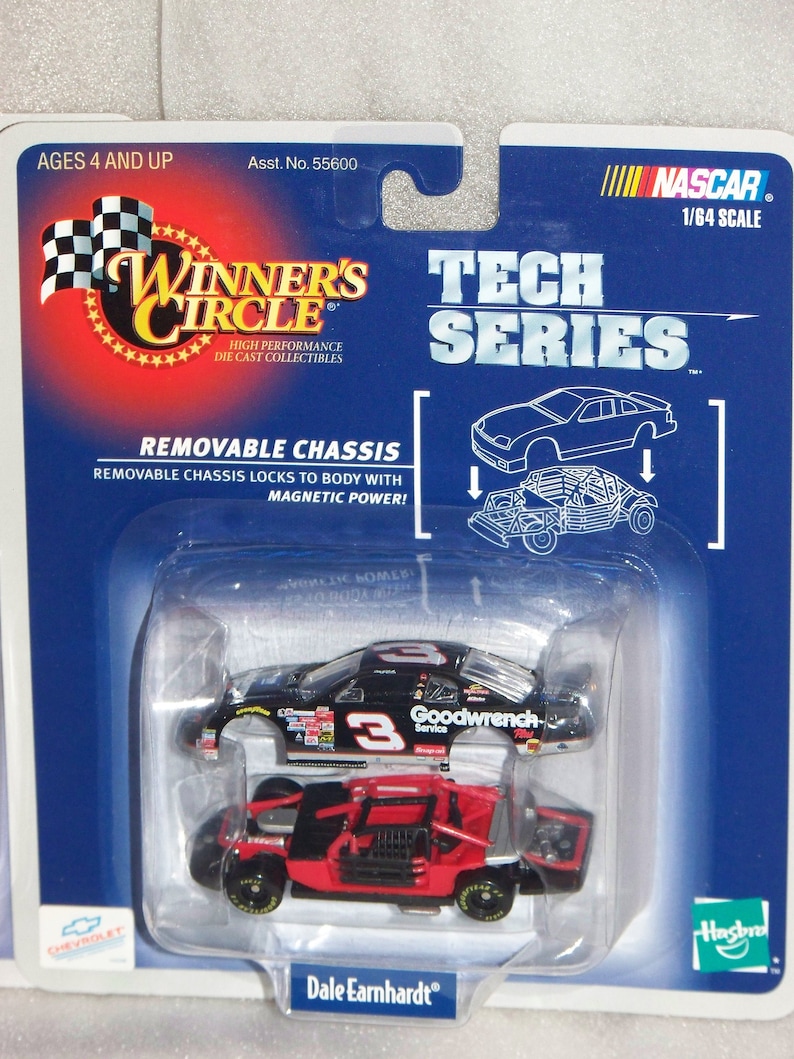 May include: A NASCAR Tech Series die-cast collectible toy car, 1/64 scale, featuring a removable chassis. The black and red car is packaged in a blue blister pack with the text "Winner's Circle" and "Dale Earnhardt". Ages 4 and up.