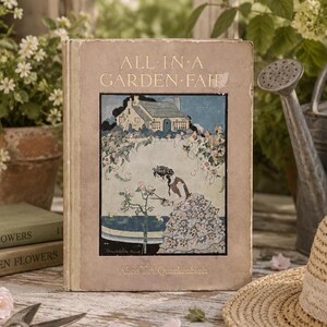 May include: A vintage hardcover book titled All in a Garden Fair by Alice T.A. Quackenbush. The cover features a tan background with a central illustration of a person in a floral dress pruning roses in front of a cottage. The text is printed in black.