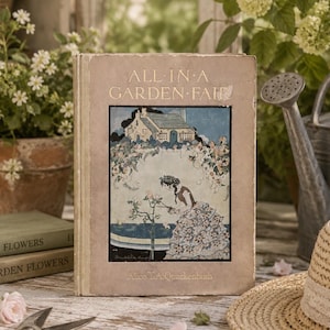 May include: A vintage hardcover book titled All in a Garden Fair by Alice T.A. Quackenbush. The cover features a central illustration of a person in a floral dress tending to roses in front of a cottage, framed by a light brown border.