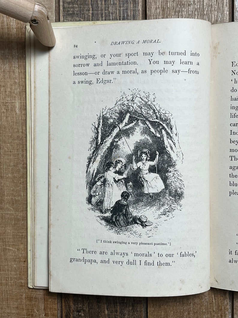 May include: A black and white illustration of children playing on a swing set in a forest. The text "There are always 'morals' to our 'fables,' grandpa, and very dull I find them." is printed below the image.