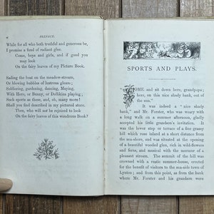 May include: An open book with a white background and black text. The book is titled "Sports and Plays." The text on the page describes a scene of a grandfather and grandson sitting on a shady bank.
