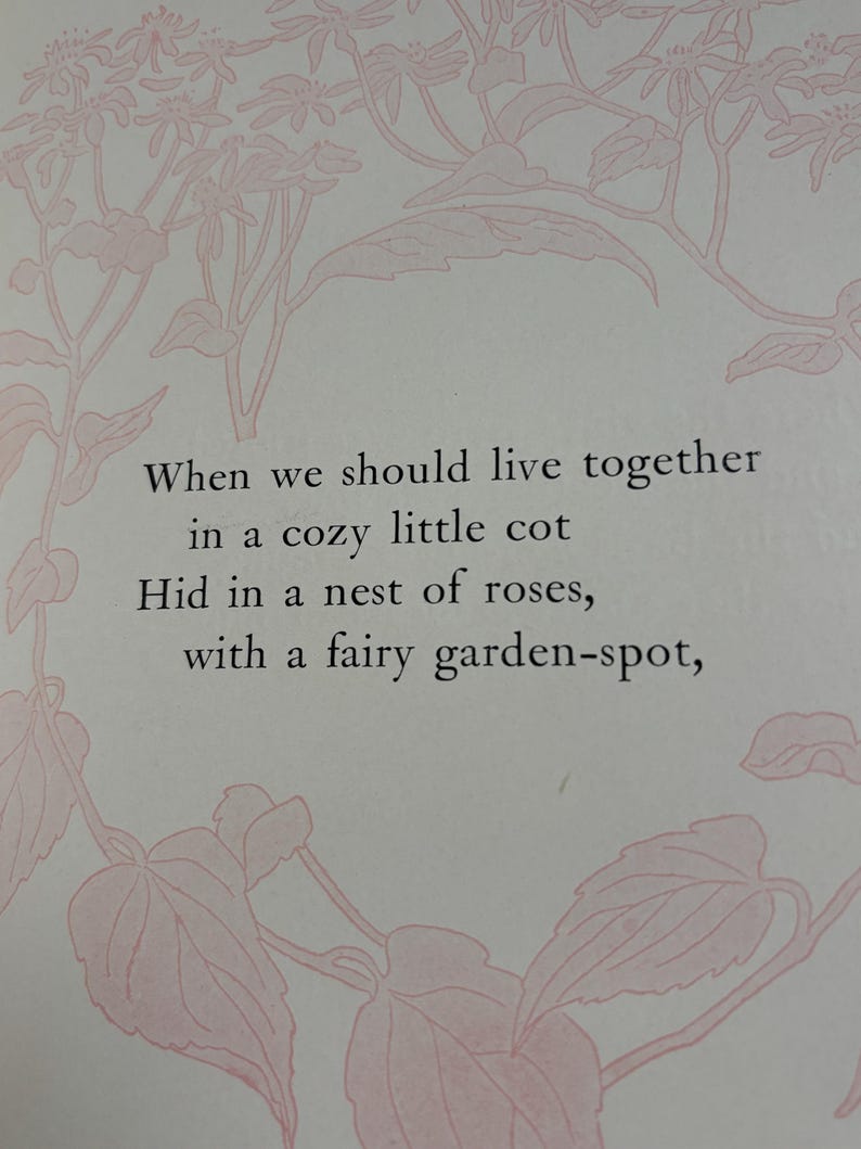 May include: A page featuring light pink line art illustrations of rose vines framing the text: When we should live together in a cozy little cot, Hid in a nest of roses, with a fairy garden-spot. The text is printed in a dark serif font.