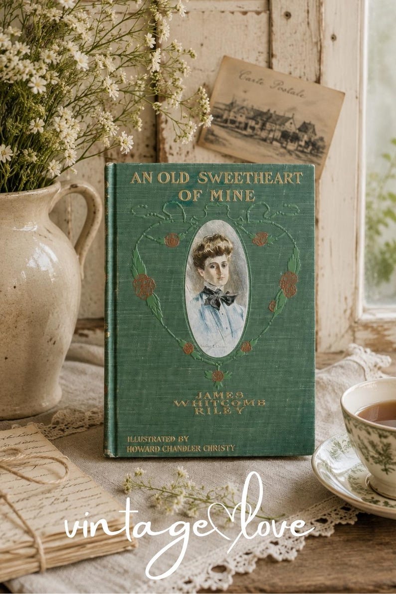 May include: A green hardcover book titled An Old Sweetheart of Mine by James Whitcomb Riley, illustrated by Howard Chandler Christy. The cover features a central oval portrait of a person, gold embossed lettering, and decorative floral vine details.