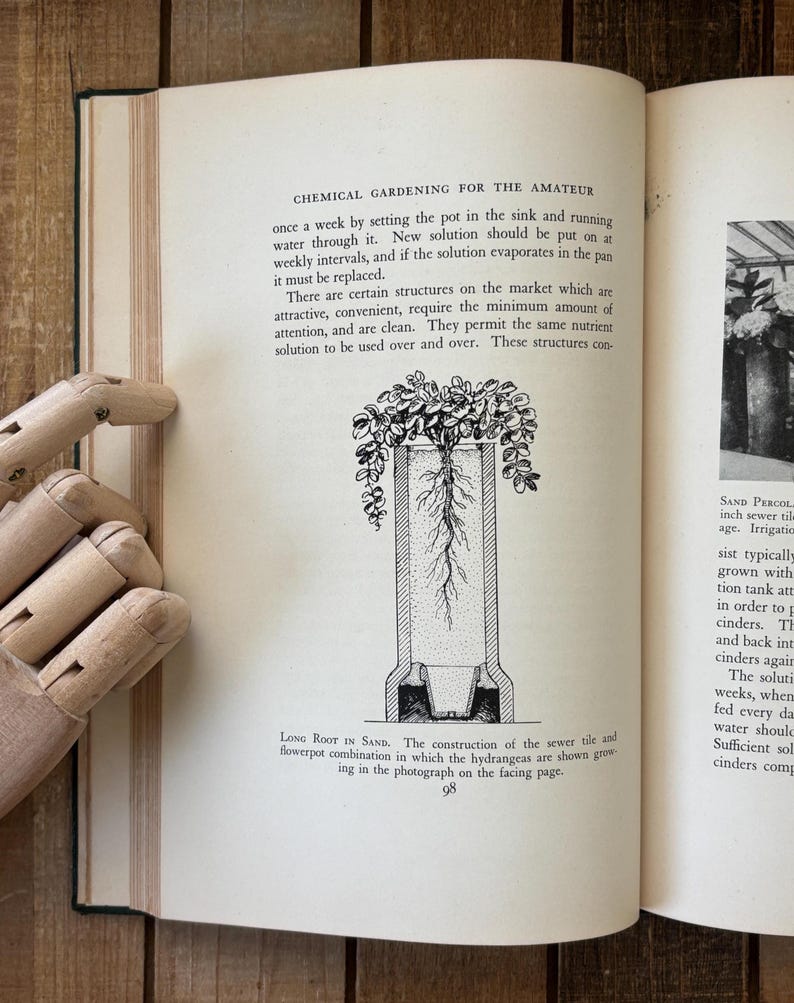 May include: An open book with text and a detailed illustration of a plant's root system in a container. The text discusses chemical gardening techniques for amateur gardeners. The page number 98 is visible.