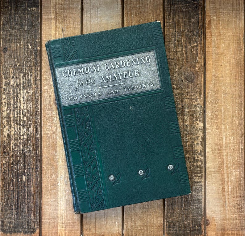 May include: A green hardcover book titled "Chemical Gardening for the Amateur" by Connors and Tiedjens. The book has a decorative design on the cover.
