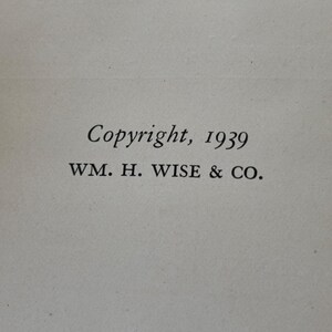 May include: Close-up of a page with the text "Copyright, 1939" and "WM. H. WISE & CO." printed in black. The text is centered on a light beige background, suggesting a vintage book or document.