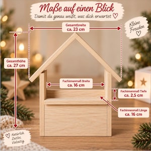 May include: A light-colored wooden house-shaped display stand with dimensions labeled in centimeters. The total height is 27 cm, total width is 23 cm, with an interior compartment width of 16 cm, length of 16 cm, and depth of 2.5 cm.