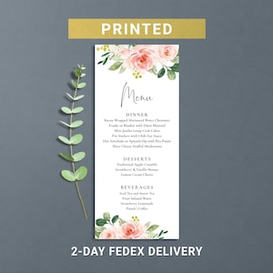 May include: A printed menu card with a floral design featuring pink roses and green leaves. The menu lists dinner, dessert, and beverage options. The word "Menu" is written in elegant script. The top of the card has the word "PRINTED".