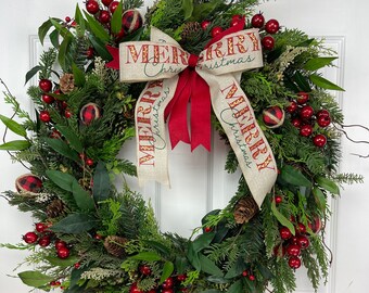 Christmas Wreath with Merry Christmas Bow, Pine, Cedar, Red Berries and Pine Cones.