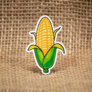 May include: A cartoon illustration of a yellow corn cob with green husks. The corn cob is on a burlap background.