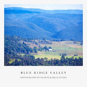 May include: A scenic landscape photograph of the Blue Ridge Valley. The image features rolling blue mountains in the background, with green fields and trees in the foreground. The text "BLUE RIDGE VALLEY" and "PHOTOGRAPHY BY HEARTH & HILLS STUDIO" are at the bottom.