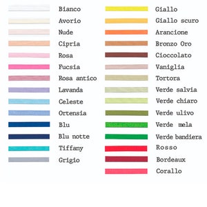 May include: A chart showing ribbon color options in Italian and English. The colors are arranged in two columns, with the Italian name on the left and the English name on the right. The colors include white, ivory, nude, beige, pink, fuchsia, light pink, lavender, light blue, blue, navy blue, turquoise, gray, yellow, dark yellow, orange, bronze, brown, vanilla, beige, light green, green, dark green, red, burgundy, and coral.