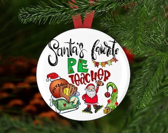 May include: A white Christmas ornament with the text "Santa's favorite PE teacher." The ornament features illustrations of sports equipment, Santa Claus, and a Christmas tree. A red ribbon is attached for hanging.