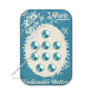 May include: A vintage-style card with eight teal, domed buttons arranged on a white lace doily. The card is teal with the words "Mode de Paris" and "Fashionable Buttons" in script. A silver needle is placed across the buttons.