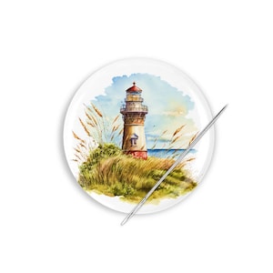 May include: A watercolor painting of a lighthouse on a small island with tall grass in the foreground. The lighthouse is white with a red roof and a small window. The sky is blue with white clouds.