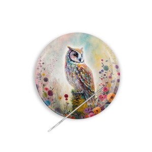 May include: A colorful owl perched on a branch surrounded by a field of flowers. The owl has a white face and brown, orange, and blue feathers. The flowers are pink, purple, yellow, and orange.