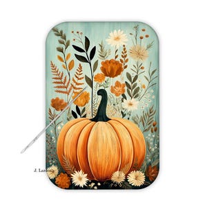 May include: A rectangular decorative tray featuring a watercolor painting of a large orange pumpkin with a green stem, surrounded by autumn flowers and foliage. The background is a light teal color. A needle is placed on the tray.