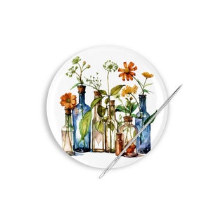 May include: A watercolor painting of a group of blue glass bottles with flowers and greenery inside. The bottles are arranged in a row on a white background.