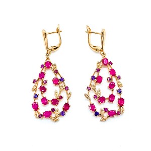May include: Gold dangle earrings with a teardrop shape. The earrings are adorned with pink and purple gemstones set in a leaf design.